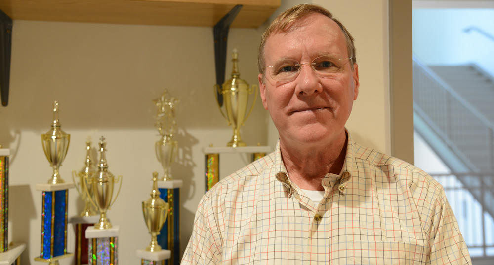 Prof. Danforth with some of the many trophies his teams have won.