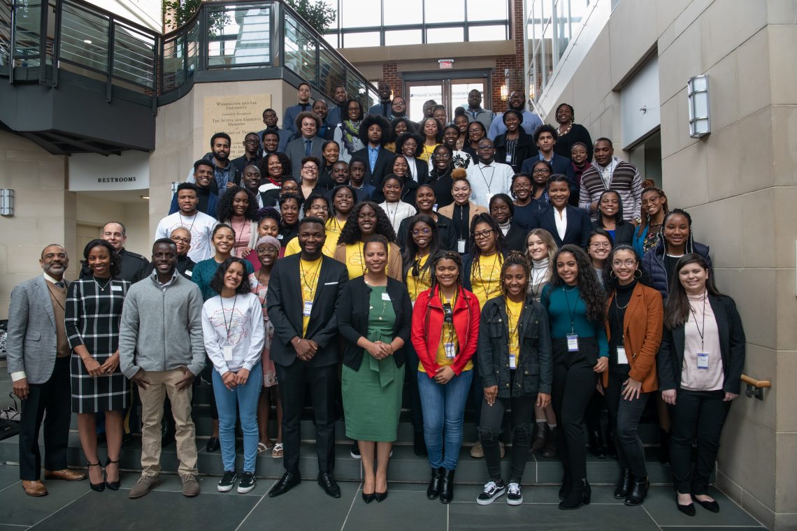 Attendees and speakers at the Black FLEX Conference pose for a photo in Elrod Commons.