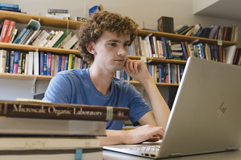 Holden Robinson ’23 works on a summer research project in the Science Center.