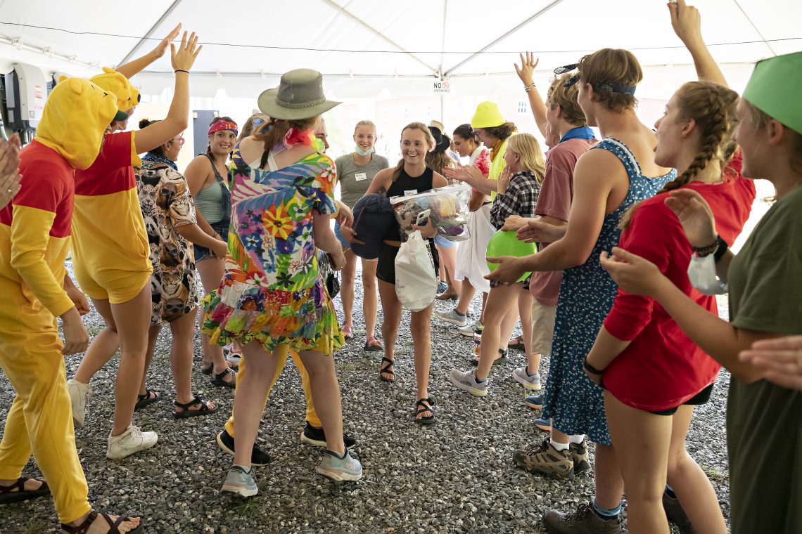 First-Year Appalachian Adventure students run the trip leader gauntlet to meet their group.