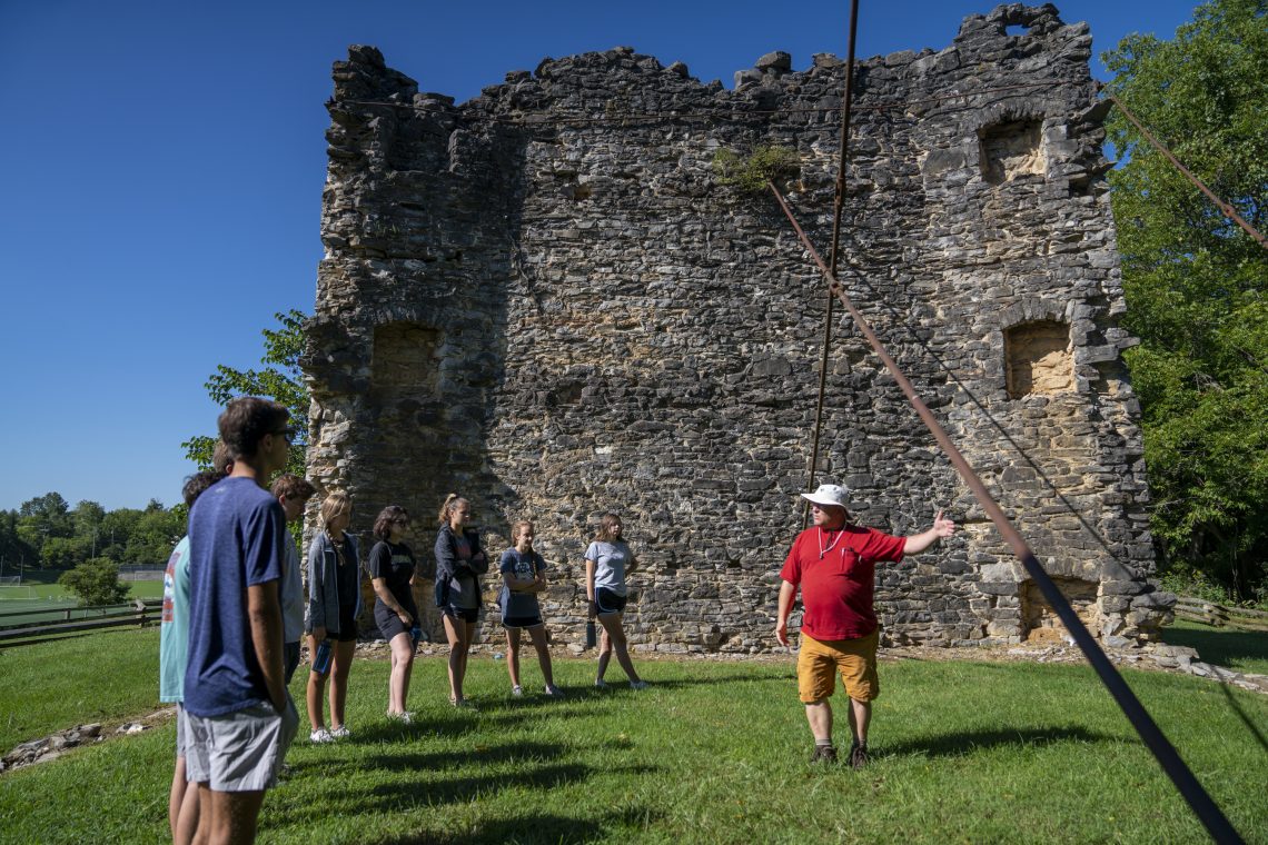 Students in the Archaeology Pre-Orientation Trip group explore Liberty Hall ruins on the W&amp;L campus with research archaeologist Don Gaylord.