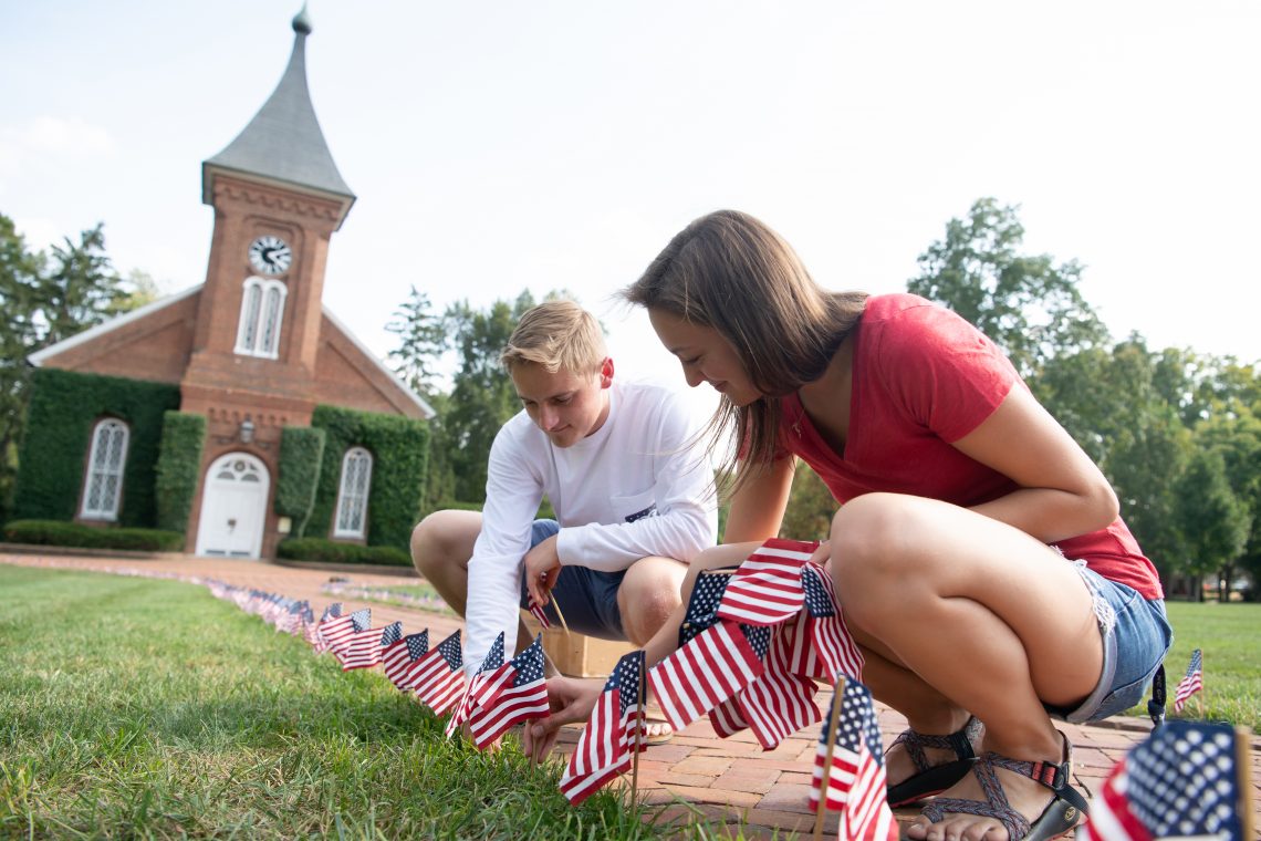 Students plant flags on the Front Lawn to mark the anniversary of the 9/11 terrorist attacks.
