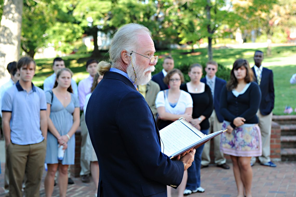 Burr Datz, then director of Leadership Development and coordinator of religious campus activities, offers a reading during a ceremony to mark the eighth anniversary of 9/11 and remember W&amp;L&#039;s fallen alumni, Robert Schlegel &#039;85 and James Gadiel &#039;00.