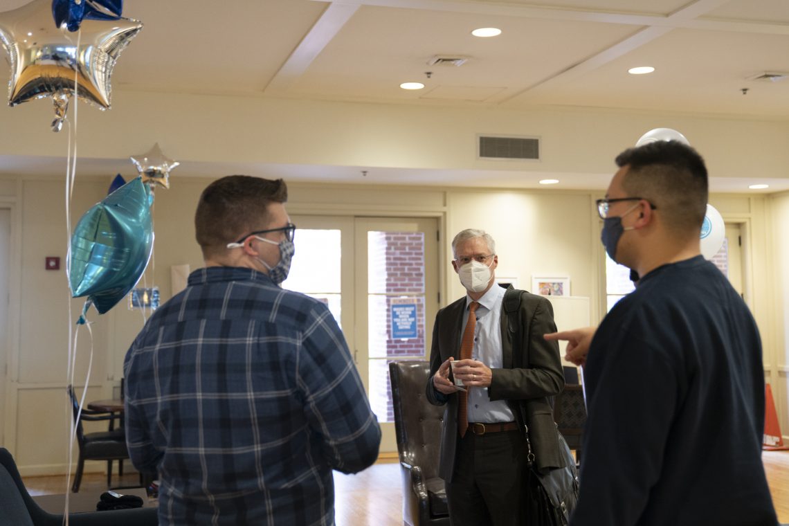 President Will Dudley (center) visits with assistant directors of Inclusion and Engagement Jake Reeves (left) and Dani Roberts (right) at W&amp;L&#039;s first-generation student celebration.