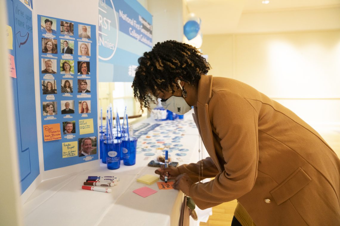 Lauryn McCray &#039;22 adds her name to the board of first-generation faculty, staff and students.