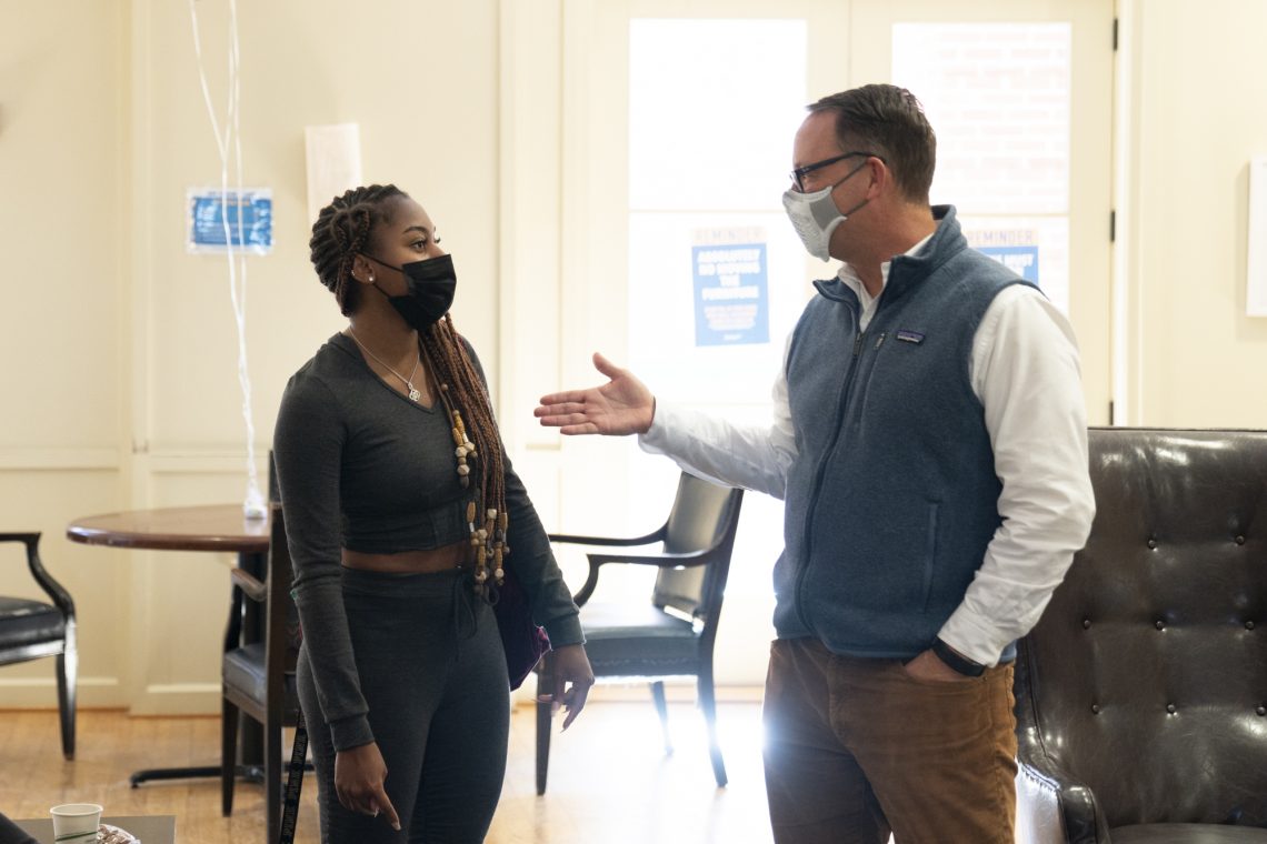 Associate Provost Paul Youngman chats with Kamryn Godsey &#039;23 at the National First-Generation Student Day celebration.