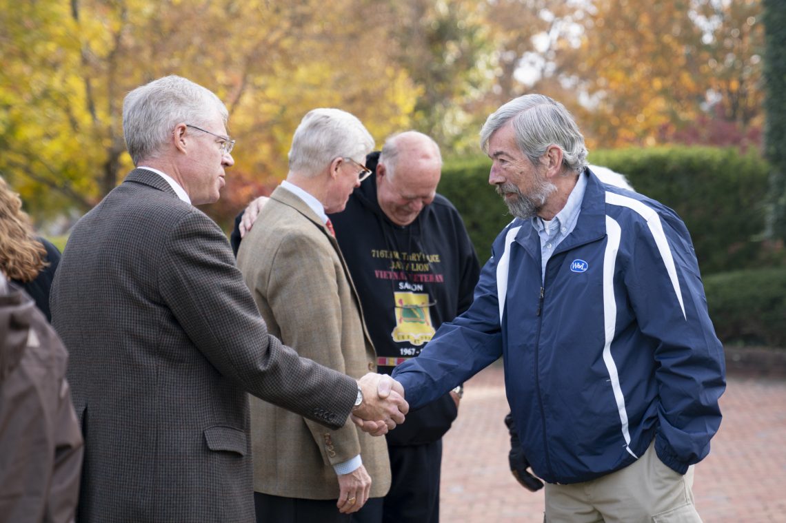 President Will Dudley greets Pat Bristol