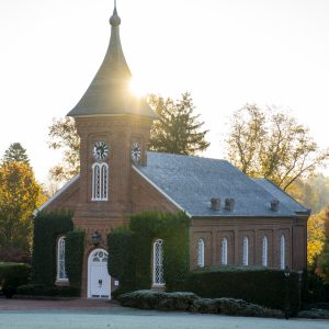 The sun rises behind University Chapel as students make their way to class.
