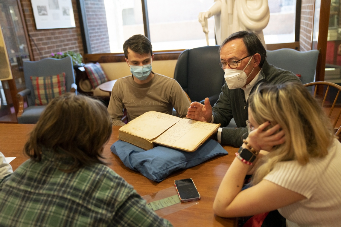 Tom Camden, head of W&amp;L Special Collections and Archives, works with history students from Powhatan High School.