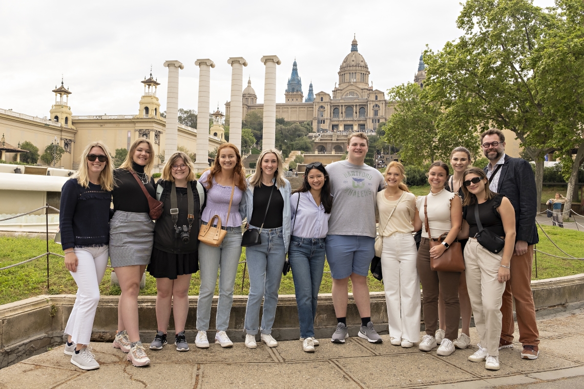 Art history professor Elliott King (right) and students in his Spring Term course stop in front of Museu Nacional d&#039;Art de Catalunya.