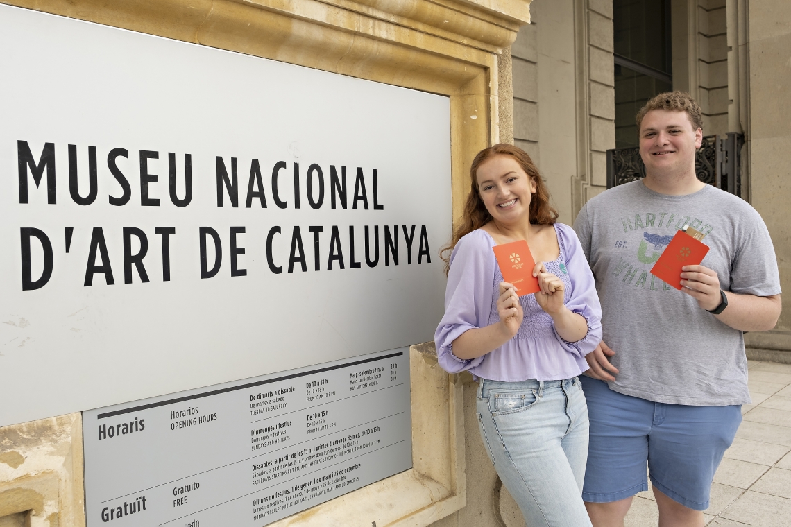 Museum passports in hand, students prepare to explore Museu Nacional d&#039;Art de Catalunya.