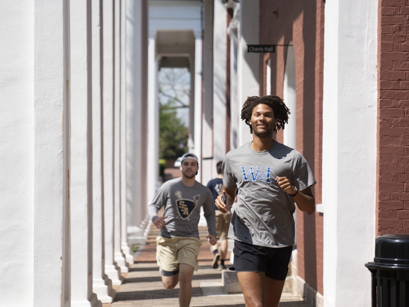 Students jogging on the Colonnade