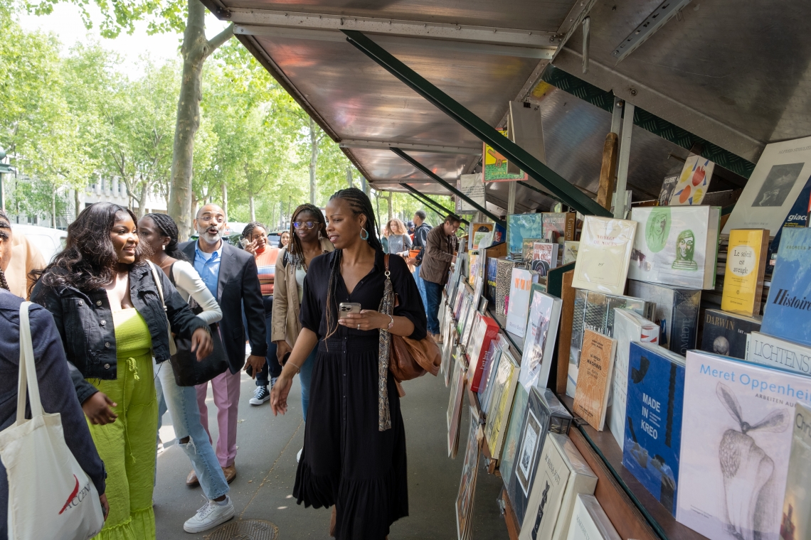Provost Lena Hill and Michael Hill, professor of Africana studies and director of the DeLaney Center, lead students through an outdoor market.
