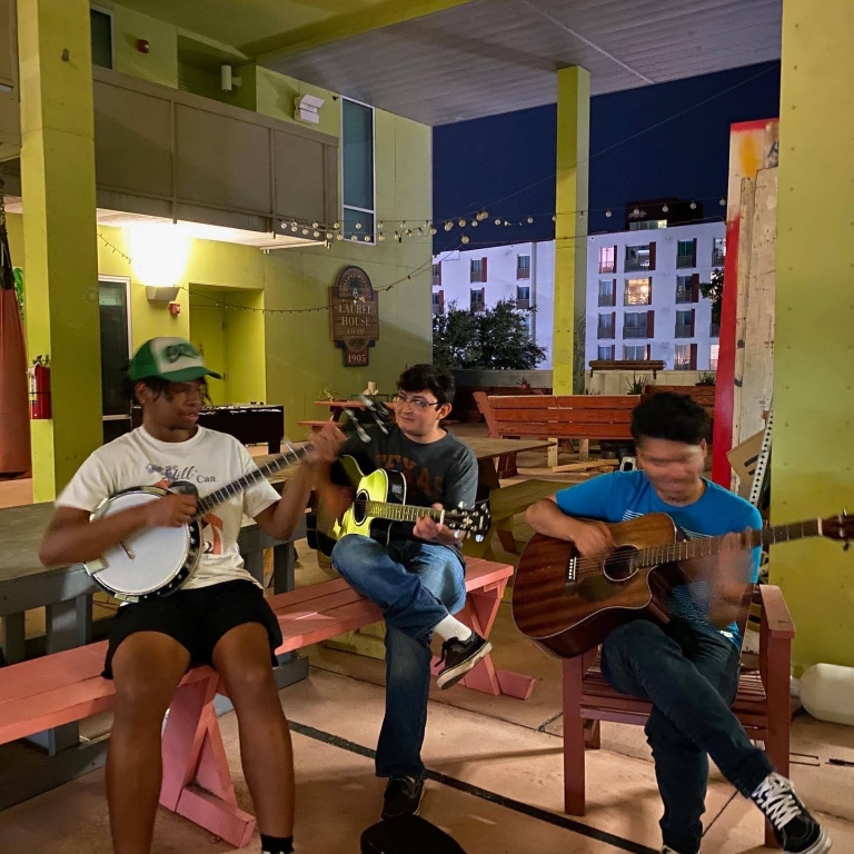 Eric Bazile &#039;25 jams with fellow summer interns.