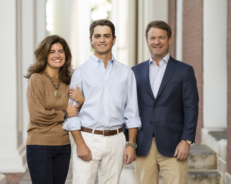 PLC Chairs Wimberly and Richard McPhail P&#039;24 pose with son Walker.