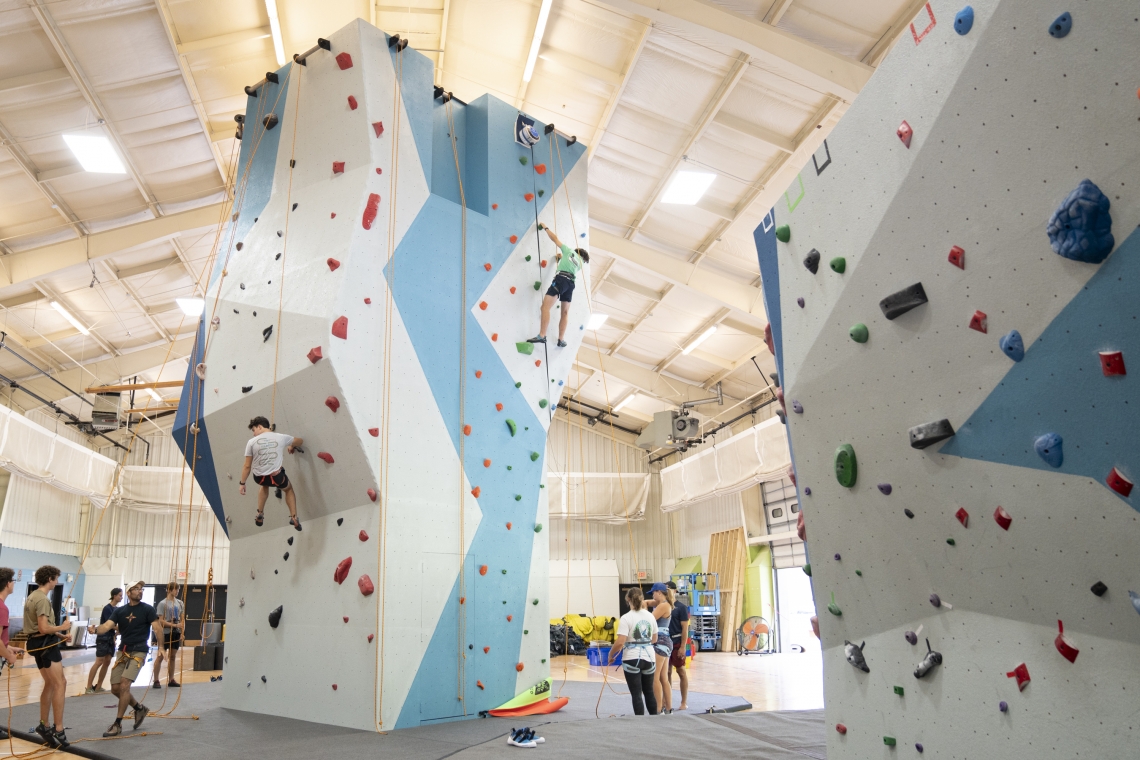 Students at Washington and Lee scale the climbing wall during a belay clinic.