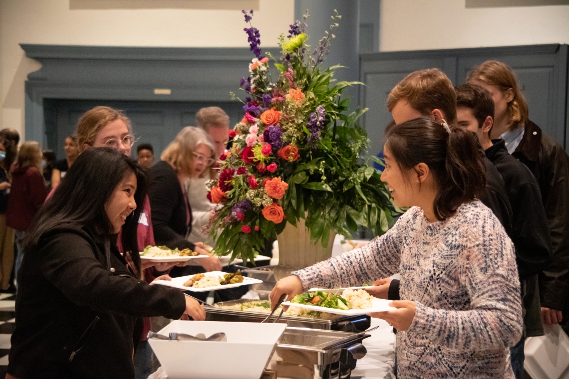 Families enjoy a dinner hosted by OIE in Evans Hall. Photo by Elena Lee &#039;25