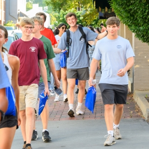 First-year students connect with local shop owners on a guided walking tour of downtown Lexington.