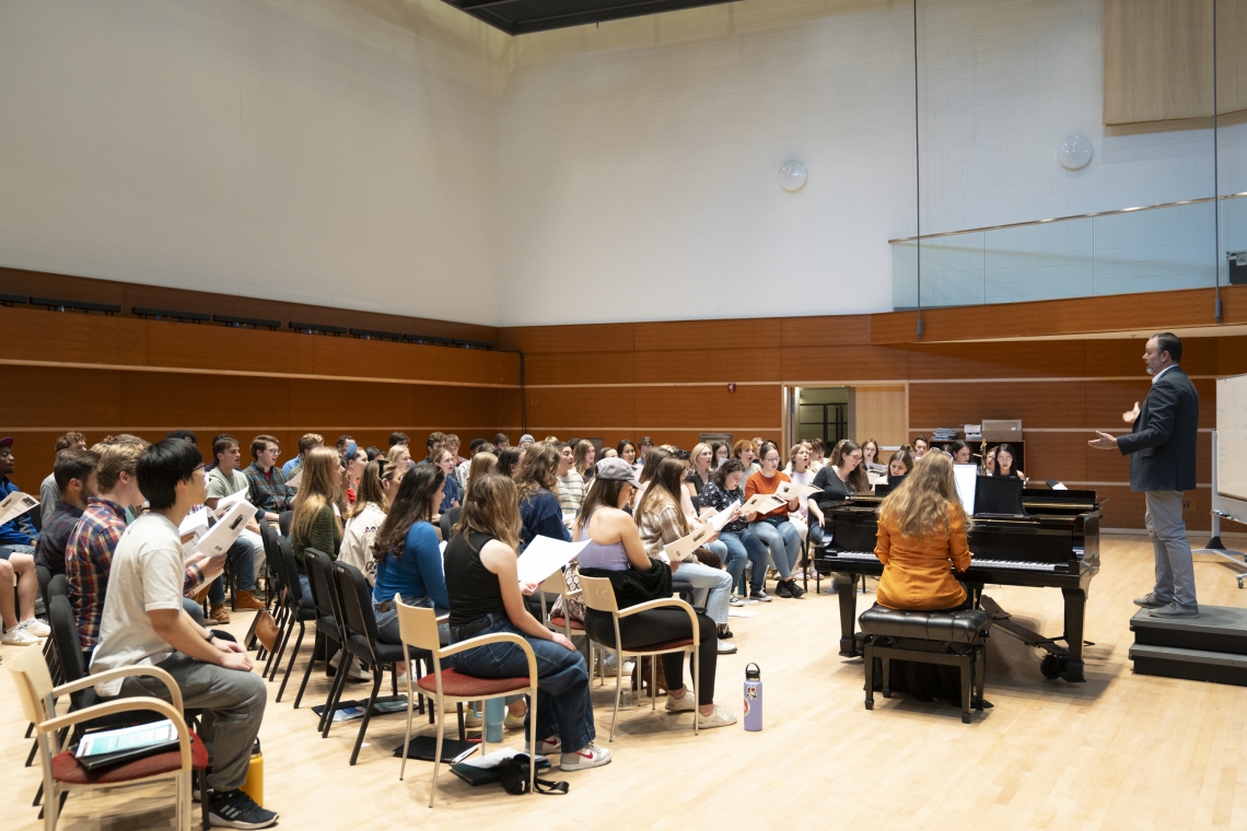 Shane Lynch, director of choral activities and professor of music, leads open rehearsal for current students and alumni during Young Alumni Weekend.