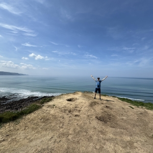 Ryan Doty &#039;26 standing on an overlook just outside of Widemouth Bay, in Cornwall, England