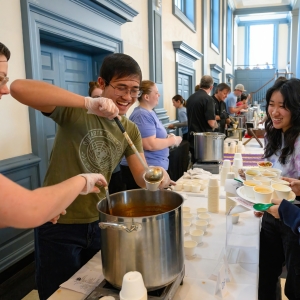 Jayden Pautz ’28 and Leon Tong ’28 serve soup to Lizzy Nguyen ’25 and Alexis Park ’25 at the 13th annual Campus Kitchen Souperbowl in Evans Dining Hall.