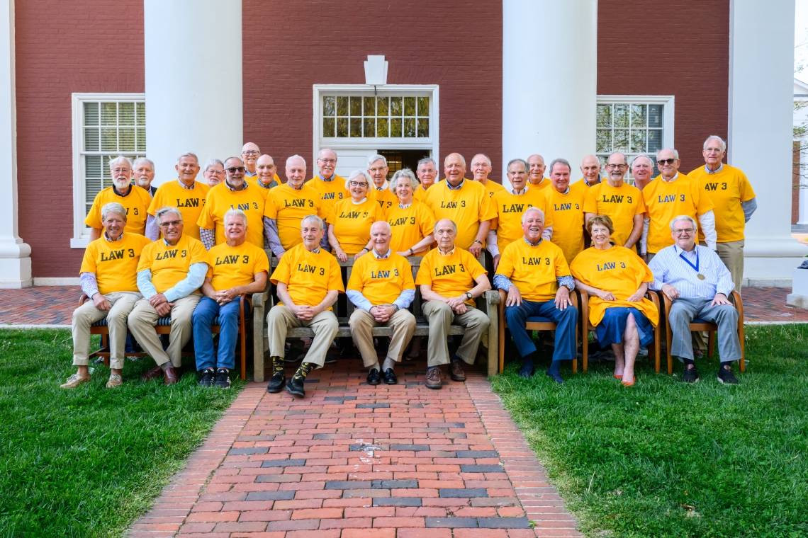 Members of the Class of 1976 Law gather for a group photo in front of Tucker Hall. They were the last law class to take classes in Tucker.