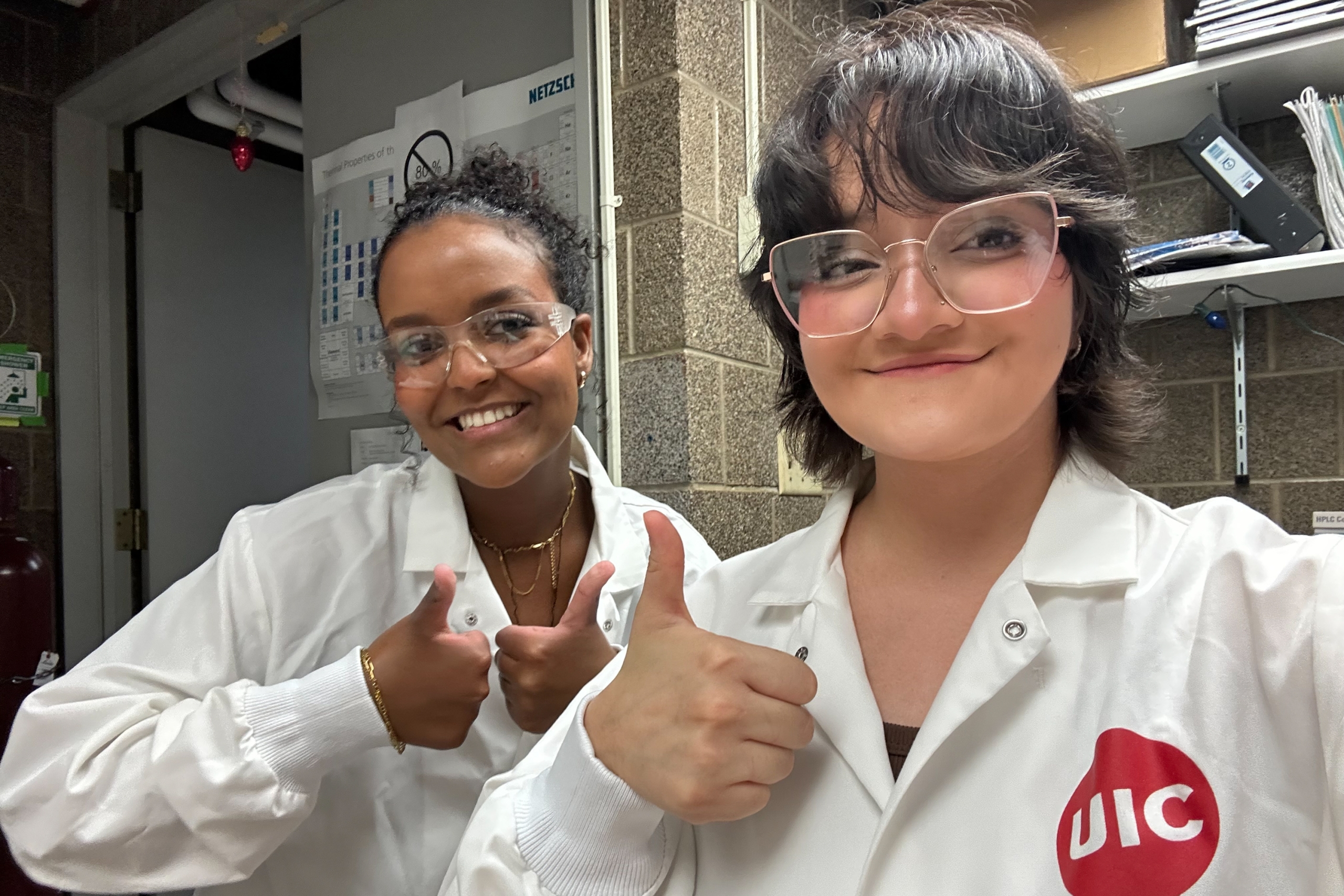Beamlak Abebe ’28 (left) and her fellow intern pose for a photo in the lab at the University of Illinois Chicago. Abebe spent her summer conducting medical research through W&L’s DART summer internship program.